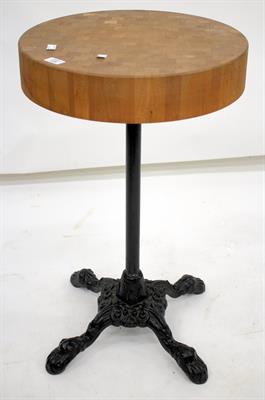Lot 650 - A CIRCULAR BUTCHERS BLOCK SIDE TABLE with black painted cast iron base 76cm tall