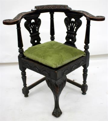 Lot 654 - A LATE VICTORIAN CARVED OAK CORNER CHAIR with pierced carved splat back