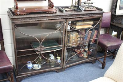 Lot 656 - A 19TH CENTURY MAHOGANY BOOKCASE CABINET with galleried top and acanthus leaf carving