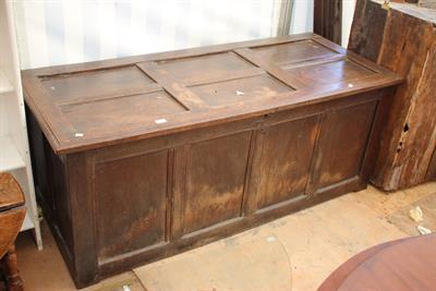 Lot 658 - A LARGE 18TH CENTURY OAK COFFER with a four panel front