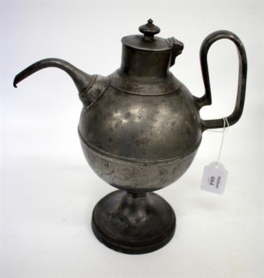 Lot 664 - AN OLD PEWTER CLARET JUG of spherical form with hinged lid