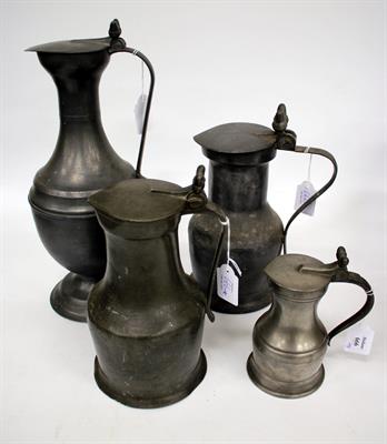 Lot 666 - A CONTINENTAL PEWTER CLARET JUG of baluster form with hinged lid and twin acorn thumb piece 39.5cm