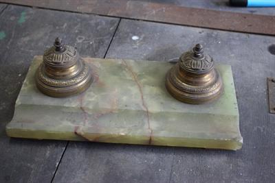 Lot 668 - A CONTINENTAL GILT METAL AND ONYX DESK STAND with cast inkwells of turned form with hinged lids and