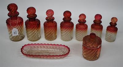 Lot 669 - A GROUP OF MOULDED BACCARAT PERFUME BOTTLES of cable twist design and with glass stoppers