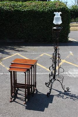 Lot 676 - A VICTORIAN BLACK PAINTED ADJUSTABLE WROUGHT IRON LAMP STANDARD with tripod base together with a