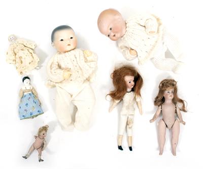 Lot 77 - A COLLECTION OF SEVEN MINIATURE DOLLS