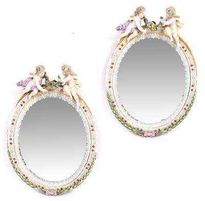 Lot 660 - A PAIR OF LATE 19TH CENTURY CONTINENTAL PORCELAIN OVAL WALL MIRRORS