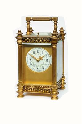 Lot 38 - A 19TH CENTURY FRENCH CARRIAGE CLOCK the circular convex white enamel Gothic dial decorated with