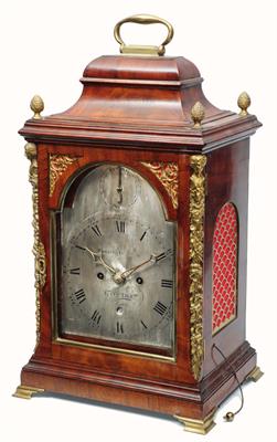 Lot 45 - A GEORGE III MAHOGANY BRACKET CLOCK the silvered break arch dial signed Christopher Bullock