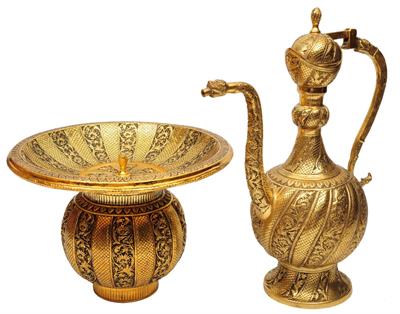 Lot 121 - AN INDIAN GILT BRASS EWER