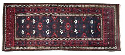 Lot 193 - AN OLD BELOUCH DARK RED GROUND RUG with white star motif in a geometric border