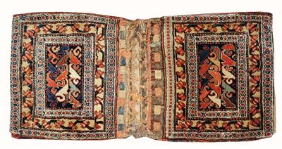 Lot 195 - A PAIR OF KURDISH SADDLE BAGS with scrolling motif and banded flat weave backs