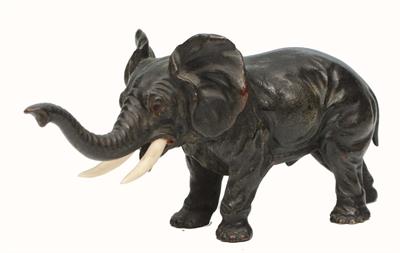 Lot 199 - A BRONZE MINIATURE MODEL of a bull elephant in aggressive stance with ivory horns