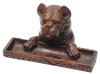 Lot 203 - A 'BLACK FOREST' CARVED WOODEN DESK STAND in the form of dogs head with glass liner and collar