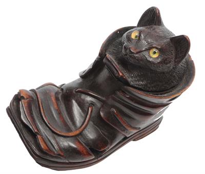 Lot 204 - A 'BLACK FOREST' CARVED WOODEN INKWELL in the form of a cat with glass eyes in a boot