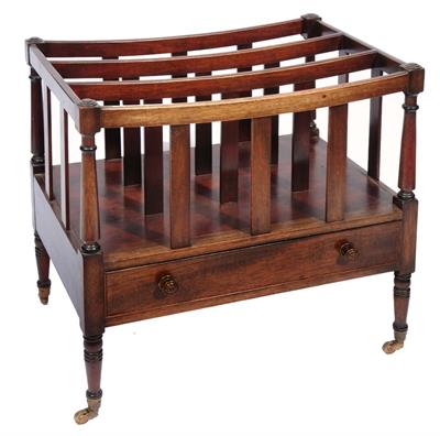 Lot 210 - A REGENCY STYLE MAHOGANY THREE DIVISIONAL CANTERBURY with one long drawer on ring turned legs and