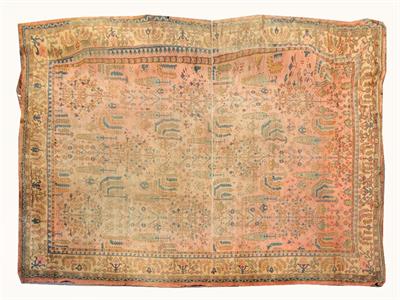 Lot 215 - AN OLD TURKEY RED GROUND LARGE CARPET with all over traditional stylised decoration