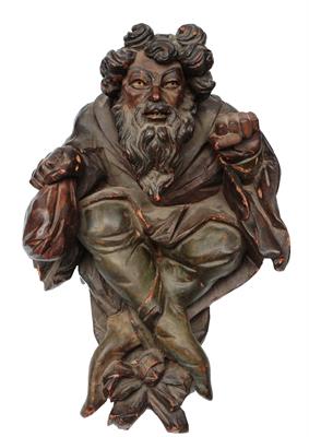 Lot 217 - AN 18TH CENTURY FLEMISH CARVED WOODEN BRACKET in the form of a hirsute money lender holding a purse