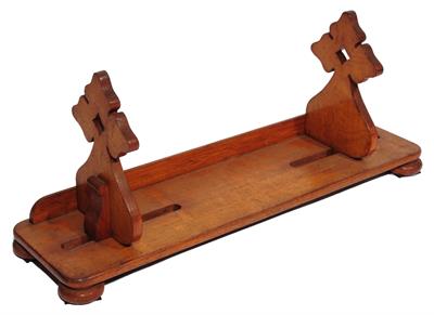 Lot 223 - A VICTORIAN OAK BOOK SLIDE with pierced and shaped end supports