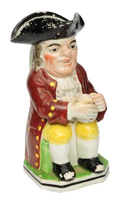 Lot 236 - A TRADITIONAL 19TH CENTURY STAFFORDSHIRE POTTERY TOBY JUG polychrome decorated with loop handle