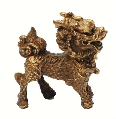 Lot 256 - A TIBETAN METAL IMAGE of a Snow Lion