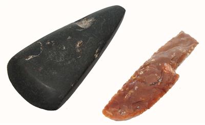 Lot 262 - A BLACK STONE AXE and Neolithic flint style blade