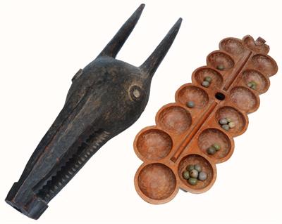 Lot 270 - AN AFRICAN MANCALA BOARD with gaming counters and a large African wooden animal head mask (2)