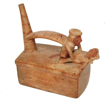 Lot 305 - A MOHICA (PERU) RED CLAY SPOUT AND BRIDGE VESSEL in the form of a copulating couple with rectangular