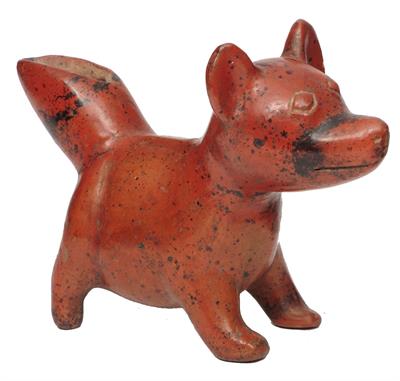 Lot 333 - A COLIMA (MEXICO) BURNISHED RED TERRACOTTA VESSEL in the form of a puppy with exaggerated tail spout