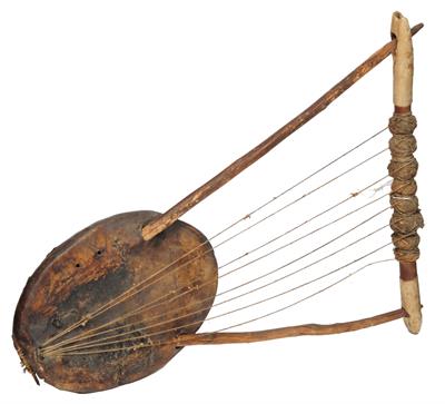 Lot 366 - A PRIMITIVE AFRICAN MUSICAL STRINGED INSTRUMENT made from animal hide and acacia wood