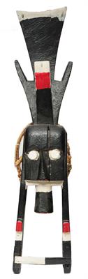Lot 369 - A NIGERIAN IJO TRIBE WATER SPIRITS PLANK MASK  worn horizontally on the dancer's head with red