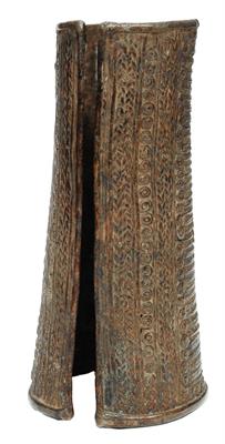 Lot 377 - AN AFRICAN METAL ELONGATED ARM BRACELET with finely detailed linear decoration
