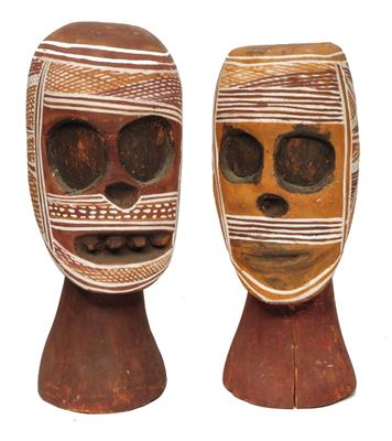 Lot 382 - A PAIR OF AUSTRALIAN ABORIGINAL CARVED WOODEN HEADS of naive form with white painted hatched