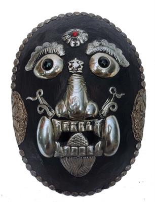 Lot 397 - A TIBETAN MAHAKALA (THE PROTECTOR DEITY) CARVED WOODEN MASK with silver coloured metal armour