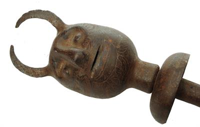 Lot 398 - A 19TH CENTURY PERSIAN ENGRAVED METAL DEMON HEAD GORZ OR WAR MASK with incised zoomorphic motifs