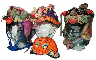 Lot 400 - A GROUP OF FOUR CHINESE POLYCHROME SILK THEATRICAL MASKS of mythological creature form on three