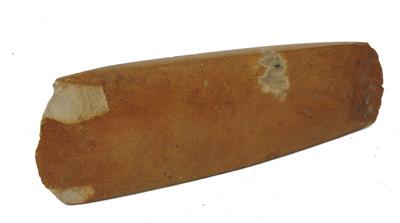 Lot 411 - AN ANCIENT POLISHED STONE AXE HEAD of tapering form