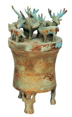 Lot 412 - A CHINESE COPPER COLOURED METAL JAR AND COVER with animal finials