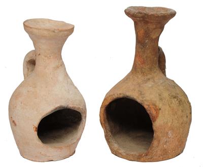 Lot 413 - TWO EARLY TERRACOTTA OIL LAMPS of side handled baluster form