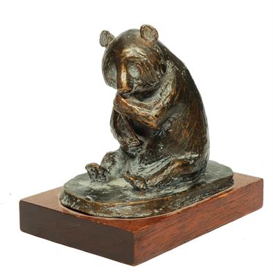Lot 435 - A BRONZE MODEL of a Panda squatting on its haunches eating bamboo