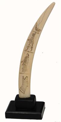 Lot 444 - A WALRUS SCRIMSHAW TUSK with finely engraved decoration