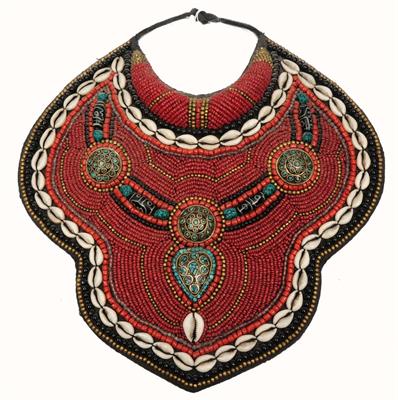 Lot 446 - A TIBETAN BEADWORK BREAST PLATE inset cowrie shell