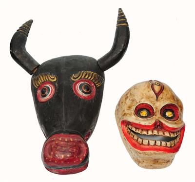 Lot 447 - A BLACK TIBETAN MASK in the form of a bull with horns