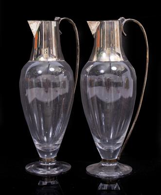 Lot 69 - A PAIR OF LATER 20TH CENTURY SILVER AND GLASS CLARET JUGS