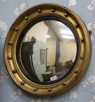 Lot 95 - A 19TH CENTURY GILT FRAMED CONVEX WALL MIRROR