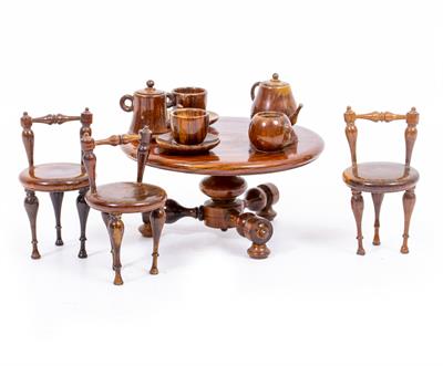 Lot 243 - AN ANTIQUE CONTINENTAL TREEN MINIATURE TABLE AND CHAIRS
