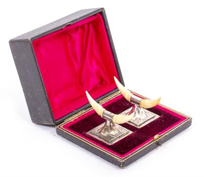 Lot 298 - A BLACK BOX CONTAINING TWO CARVER RESTS