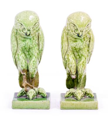 Lot 329 - A PAIR OF LATE 19TH / EARLY 20TH CENTURY GREEN GLAZED POTTERY FIGURES