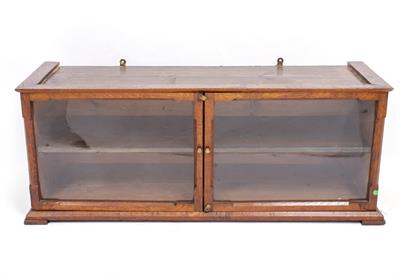 Lot 486 - A WALL HANGING OAK GLAZED TWO DOOR CABINET