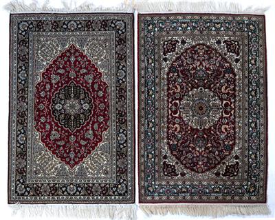 Lot 197 - Matched pair of silk Persian rugs